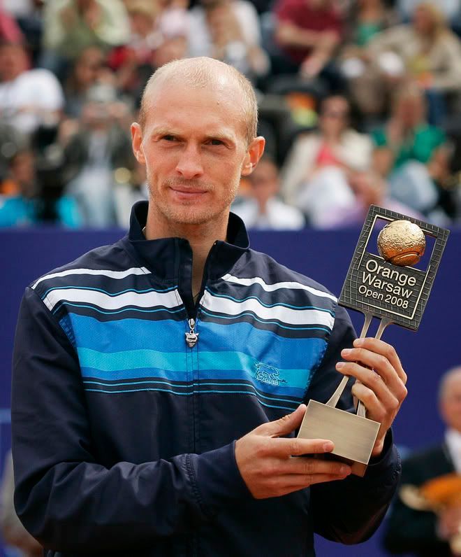 Nikolay Davydenko presents his trophy after he won the Orange Warsaw Open 2008 tennis tournament